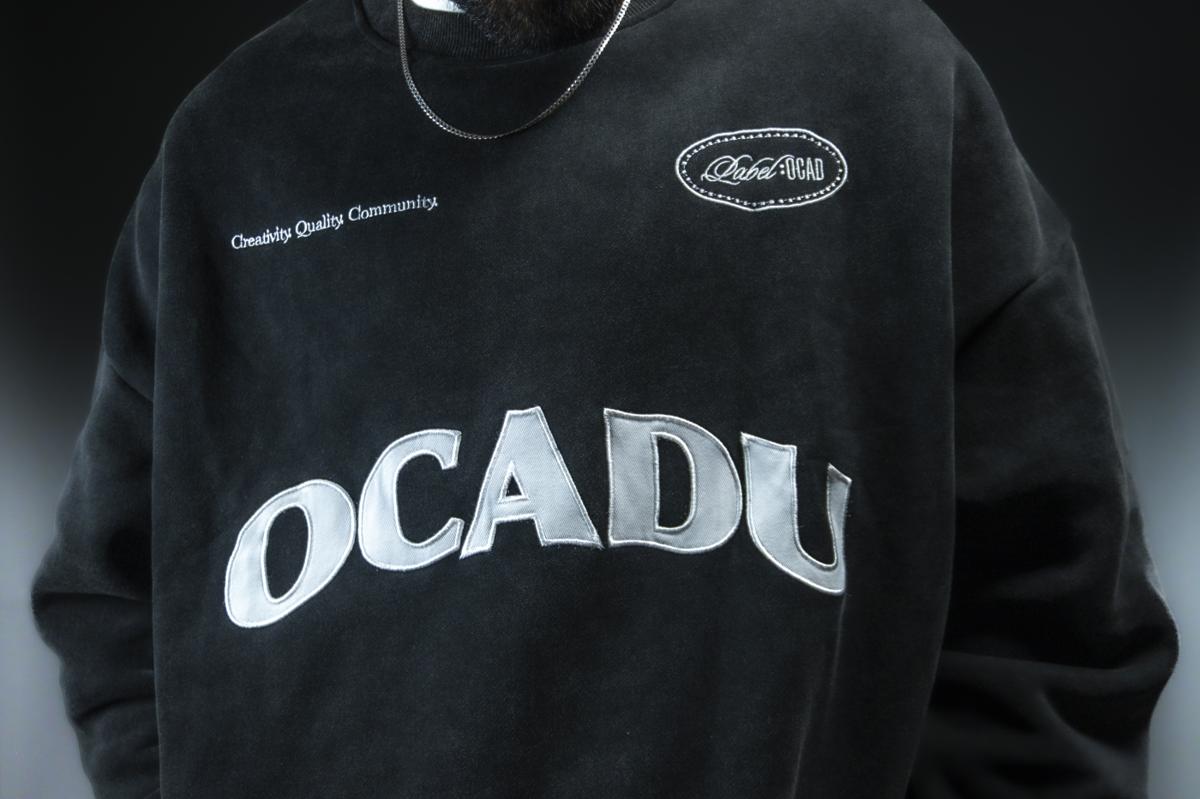 Creativity. Quality. Community. crewneck detail